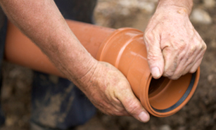 Tim, one of our Hialeah sewer line repair pros, is working on replacing a broken line